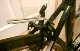Attaching rear rack to brake bolt with the metal frame